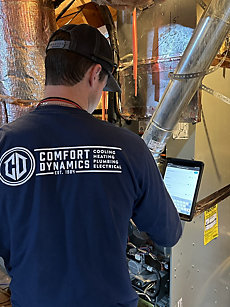 HVAC tech performing AC tune-up service at a Memphis area home