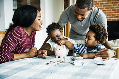 Happy Family Counting Their Savings
