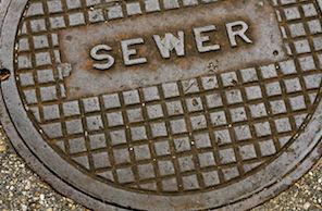 Public sewer lid that says SEWER