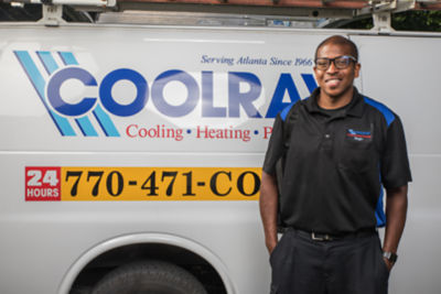 Coolray technician standing in front of van