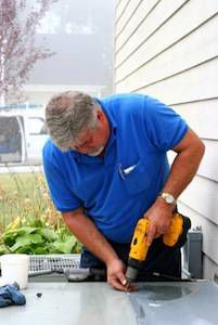 Man working with screwdriver