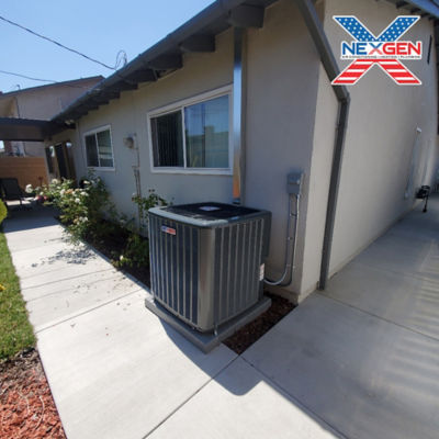 An AC unit connected to a home.