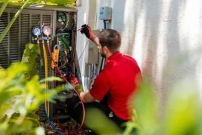 Red Cap AC Installation Technician Prepping a New Unit
