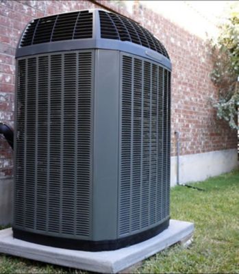 A grey heater on a concrete base