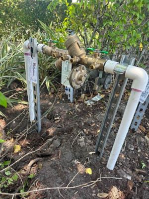 Backflow testing guage connected to a backflow preventer