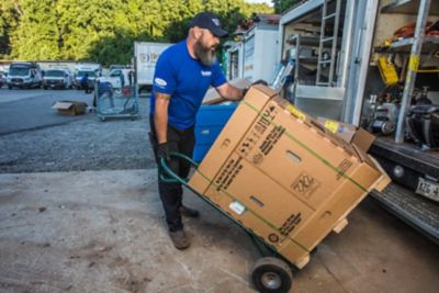 AC Installer Loading Box with Unit Into Coolray Truck