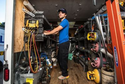 Coolray HVAC Repair Technician Organizing Tools in the Work Truck