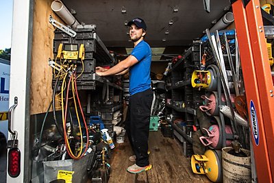 Coolray HVAC Repair Technician Organizing Tools in the Work Truck