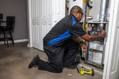 Coolray HVAC technician serving a system in Stockbridge, GA