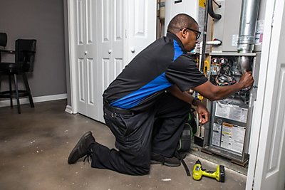 Coolray HVAC technician serving a system in Stockbridge, GA