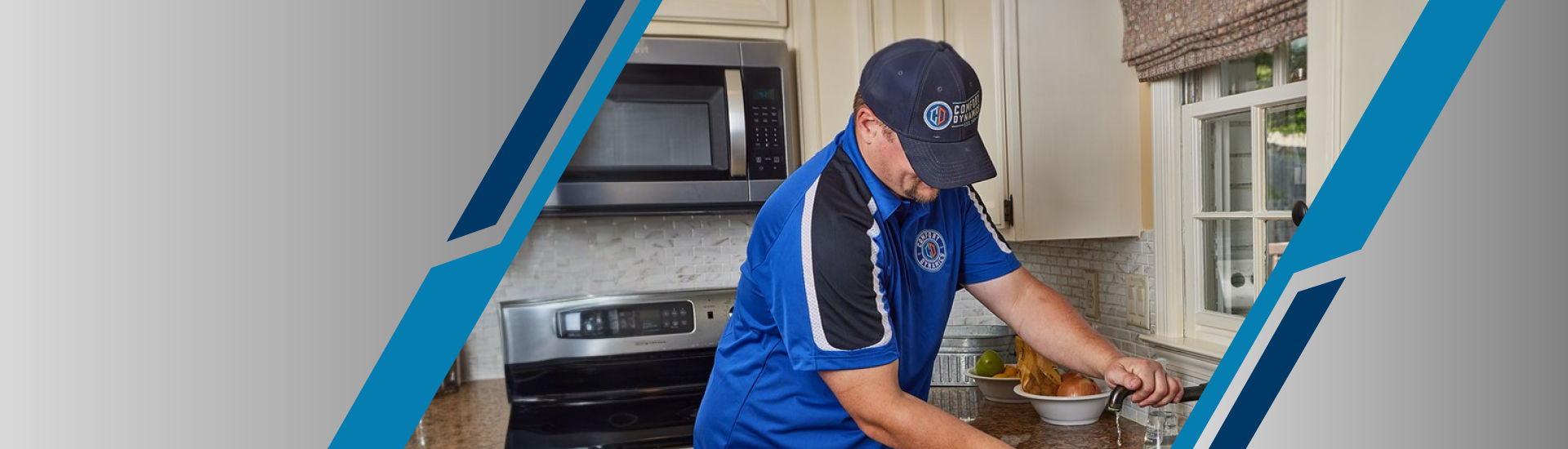 a plumber in a blue shirt fixing a tube  5 of 13 assets