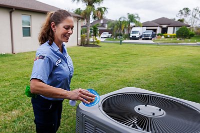 Technician checking HVAC Unit