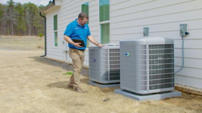 Professional HVAC Technician from Ragsdale Inpsecting Outdoor Units