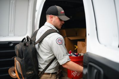 Ragsdale Plumber Getting Plumbing Parts out of Truck