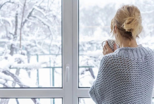 woman looking out the window