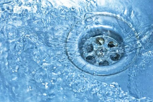 Water flowing into a sink drain