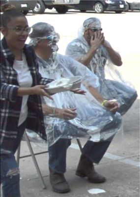 Employee walking with pie smiling