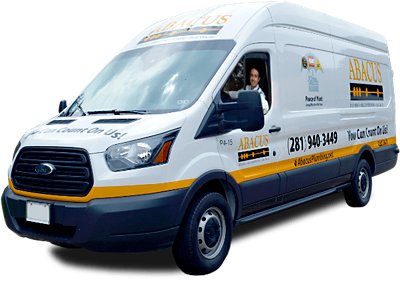 Technician, Paul sitting in a truck with a uniform shirt on