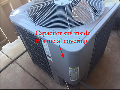 Air conditioning unit with red arrows pointing at capacitor location
