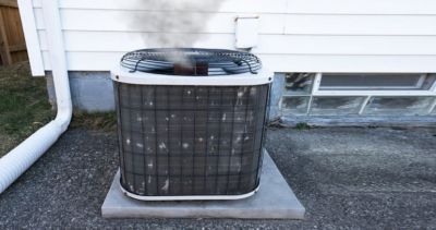 an air conditioner on a concrete platform