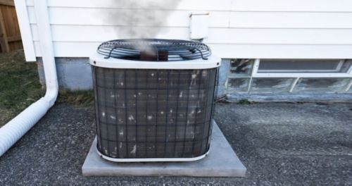 an air conditioner on a concrete platform