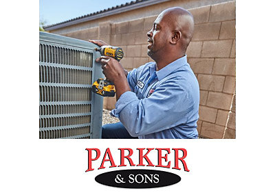 Parker & Sons HVAC technician repairing an AC system in Tucson