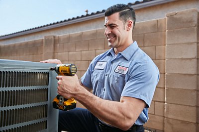 Parker & Sons Technician working on an HVAC unit