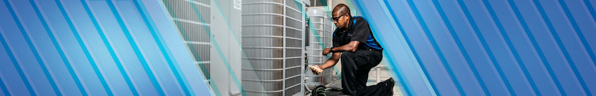 Technician working on AC unit