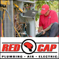 Red Cap AC technician tuning up an air conditioner unit