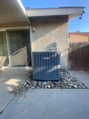 An AC unit connected to a building.