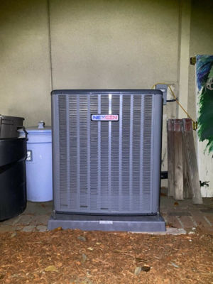 An AC unit connected to a building.