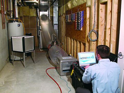 A tech sealing ductwork using the Aeroseal method