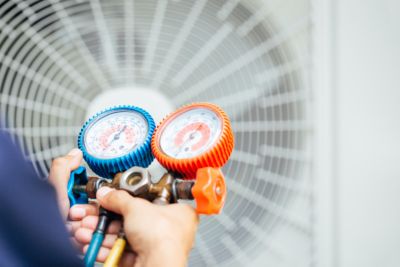 Air Conditioning Technician preparing to install new air conditioner 