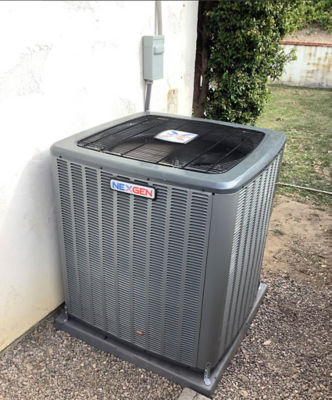 An AC unit connected to a building.