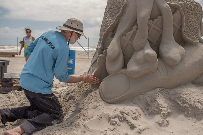Artist working on Sand Sculpture