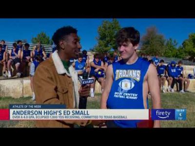 A football player talking to a reporter.