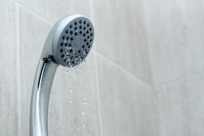 Shower head with low water stream. Broken shower in the bashroom