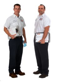 Baker Brothers technicians standing face to face smiling