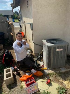 NexGen tech making repairs on a Lennox AC unit