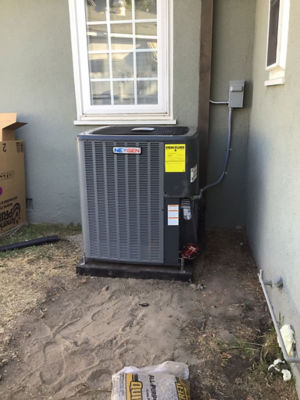 A NexGen AC Unit on the corner of a house.