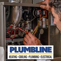 Plumbline tech repairing a furnace in a Castle Rock, CO home