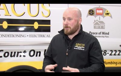 Abacus Tech Discussing Austin Cold snap in front of truck