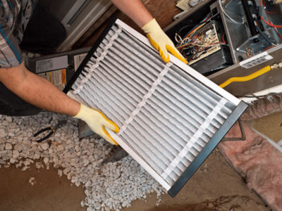 A man holding a clean air filter.