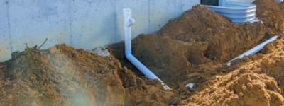 a white pipe in the dirt 
