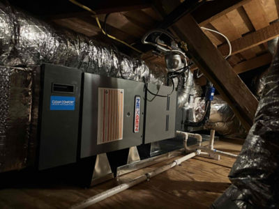 A NexGen AC unit in an attic.