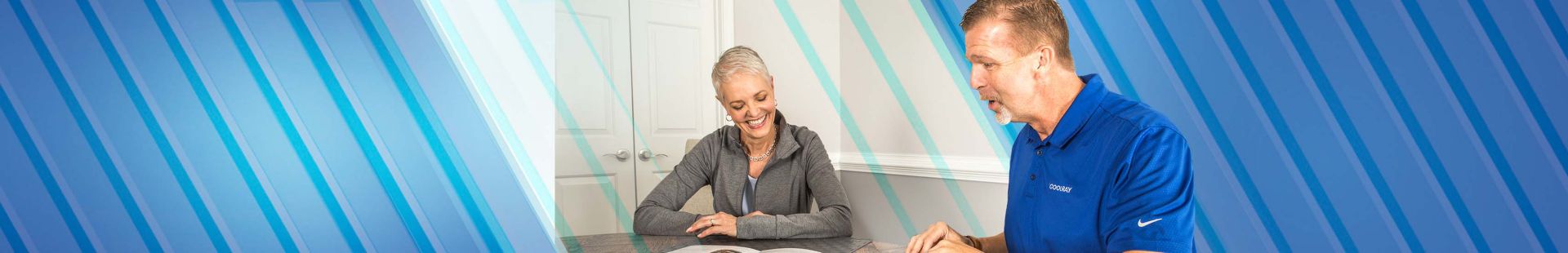 Man and woman looking at documents while smiling