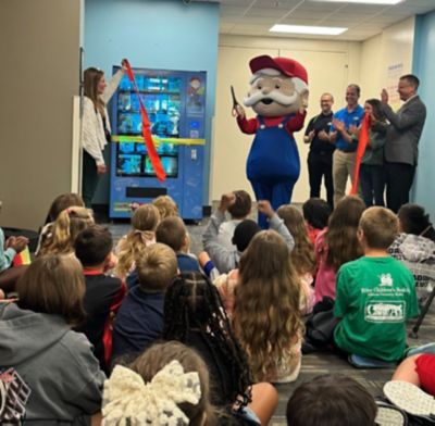 Book vending machine ribbon cutting