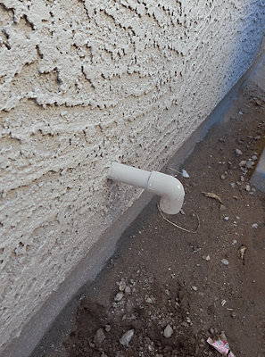 Condensate drain line outside of house