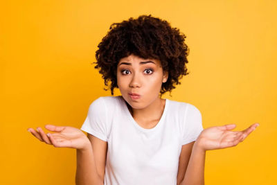 A woman shrugging her shoulders.