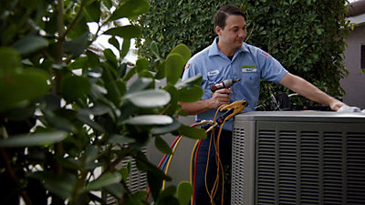 Cooltoday technician checking AC parts